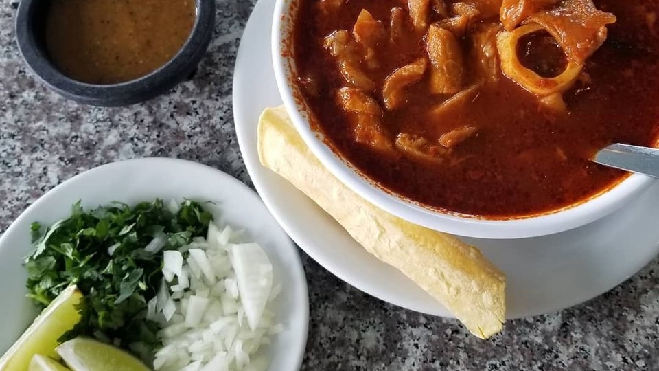 Colorful restaurant dishes with salsa and chips.
